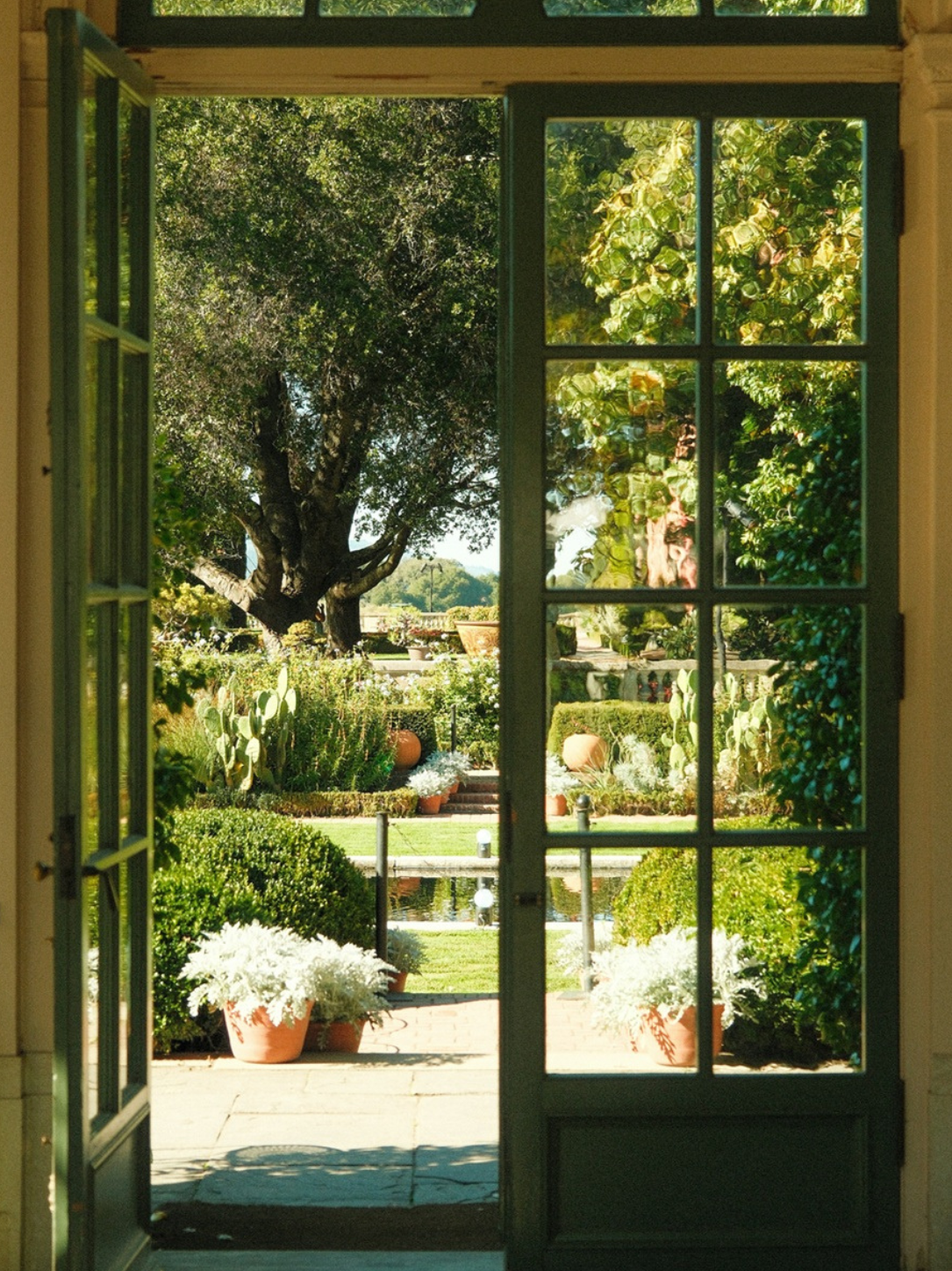 david-yao-open-doors-garden-a-reason-4-being.jpg Open French doors overlooking a lush formal garden